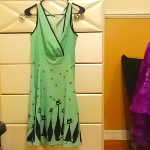Super Neat Green Dress with Cats and Stars adorning the skirt part. Med.